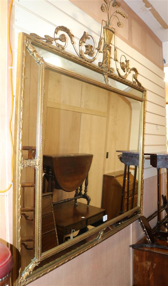 An early 20th century French gilt gesso wall mirror, W.4ft 3in. H.4ft 10in.